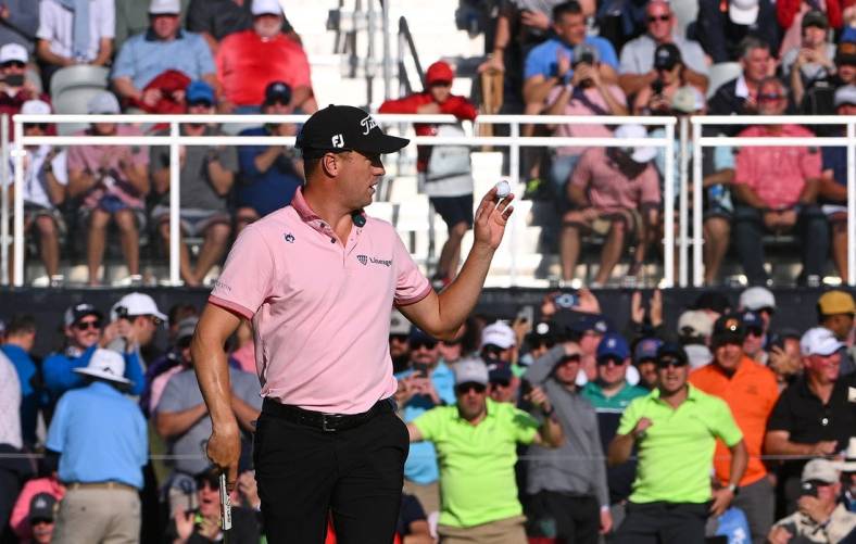 May 22, 2022; Tulsa, OK, USA; Justin Thomas acknowledges the crowd after a putt on the 17th green during the final round of the PGA Championship golf tournament at Southern Hills Country Club. Mandatory Credit: Orlando Ramirez-USA TODAY Sports