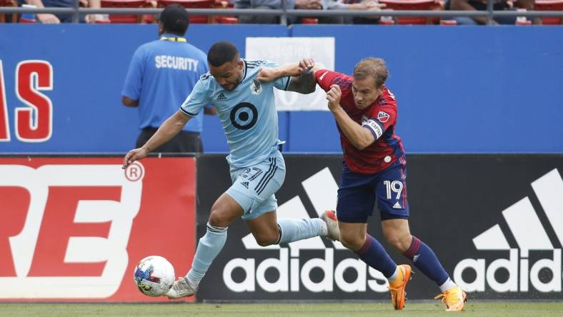 May 22, 2022; Frisco, Texas, USA; Minnesota United defender D.J. Taylor (27) and FC Dallas midfielder Paxton Pomykal (19) fight for the ball in the first half at Toyota Stadium. Mandatory Credit: Tim Heitman-USA TODAY Sports