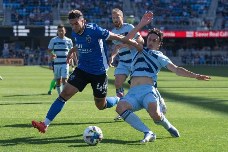 May 22, 2022; San Jose, California, USA;  San Jose Earthquakes forward Cade Cowell (44) and Sporting Kansas City defender Ben Sweat (2) fight for control of the ball during the first half at PayPal Park. Mandatory Credit: Stan Szeto-USA TODAY Sports