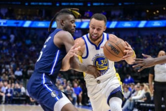 May 22, 2022; Dallas, Texas, USA; Golden State Warriors guard Stephen Curry (30) is fouled by Dallas Mavericks forward Reggie Bullock (25) during the third quarter in game three of the 2022 western conference finals at American Airlines Center. Mandatory Credit: Jerome Miron-USA TODAY Sports