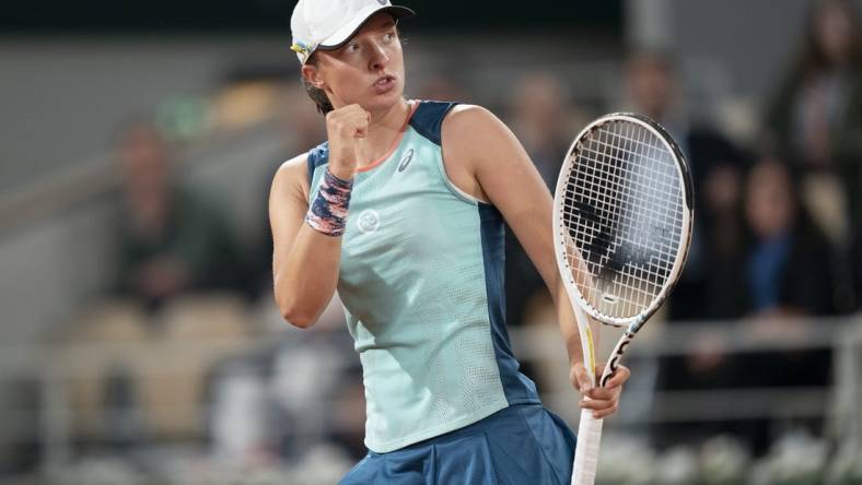 May 23, 2022; Paris, France; Iga Swiatek (POL) reacts to a point during her match against Lesia Tsurenko (UKR) on day two of the French Open at Stade Roland-Garros.   Mandatory Credit: Susan Mullane-USA TODAY Sports