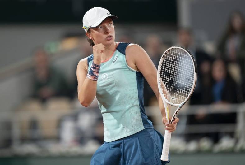 May 23, 2022; Paris, France; Iga Swiatek (POL) reacts to a point during her match against Lesia Tsurenko (UKR) on day two of the French Open at Stade Roland-Garros.   Mandatory Credit: Susan Mullane-USA TODAY Sports
