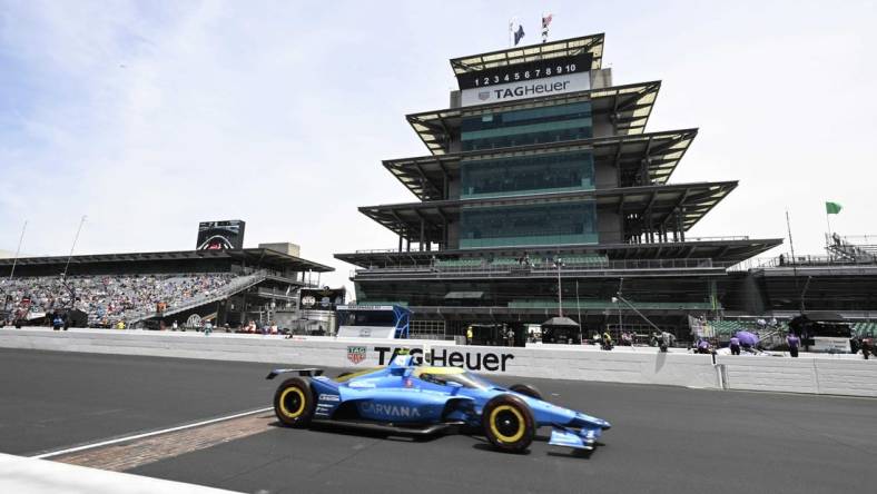 May 23, 2022; Indianapolis, Indiana, Chip Ganassi Racing driver Jimmie Johnson (48) crosses the line of bricks during practice after qualifying for the 106th Indianapolis 500 at the Indianapolis Motor Speedway. Mandatory Credit: Marc Lebryk-USA TODAY Sports