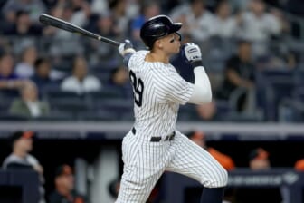 May 23, 2022; Bronx, New York, USA; New York Yankees right fielder Aaron Judge (99) follows through on a two run home run against the Baltimore Orioles during the fifth inning at Yankee Stadium. Mandatory Credit: Brad Penner-USA TODAY Sports