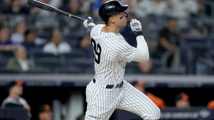 May 23, 2022; Bronx, New York, USA; New York Yankees right fielder Aaron Judge (99) follows through on a two run home run against the Baltimore Orioles during the fifth inning at Yankee Stadium. Mandatory Credit: Brad Penner-USA TODAY Sports