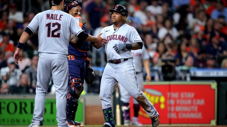 May 23, 2022; Houston, Texas, USA; Cleveland Guardians third baseman Jose Ramirez (11, center) is greeted at home plate by Cleveland Guardians catcher Luke Maile (12) after hitting a two-run home run against the Houston Astros during the fifth inning at Minute Maid Park. Mandatory Credit: Erik Williams-USA TODAY Sports