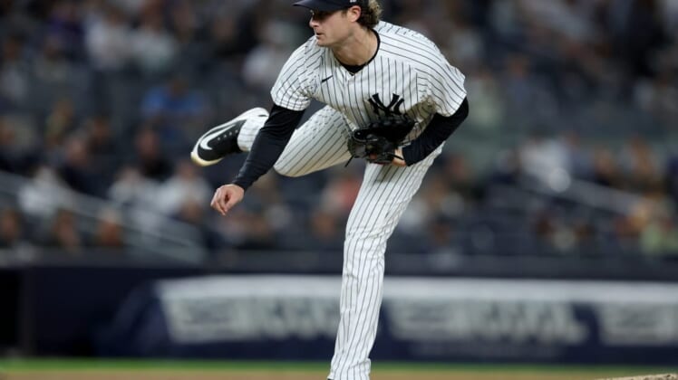 May 23, 2022; Bronx, New York, USA; New York Yankees starting pitcher Gerrit Cole (45) follows through on a pitch against the Baltimore Orioles during the fifth inning at Yankee Stadium. Mandatory Credit: Brad Penner-USA TODAY Sports