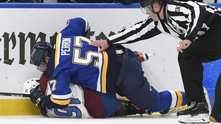 May 23, 2022; St. Louis, Missouri, USA; St. Louis Blues left wing David Perron (57) fights Colorado Avalanche center Nazem Kadri (91) during the second period in game four of the second round of the 2022 Stanley Cup Playoffs at Enterprise Center. Mandatory Credit: Jeff Le-USA TODAY Sports