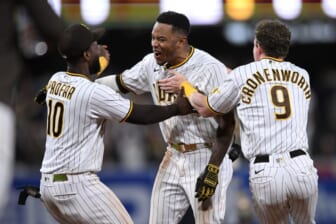 May 23, 2022; San Diego, California, USA; San Diego Padres center fielder Jose Azocar (center) is congratulated by left fielder Jurickson Profar (10) and shortstop Jake Cronenworth (9) after hitting a walk-off single during the tenth inning against the Milwaukee Brewers at Petco Park. Mandatory Credit: Orlando Ramirez-USA TODAY Sports