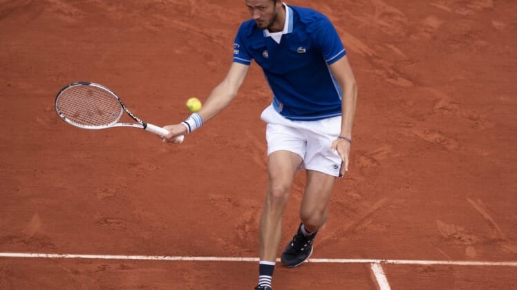May 24, 2022; Paris, France; Daniil Medvedev returns a shot from Fecund Bagnis (ARG) during their match on day three of the French Open at Stade Roland-Garros.Mandatory Credit: Susan Mullane-USA TODAY Sports