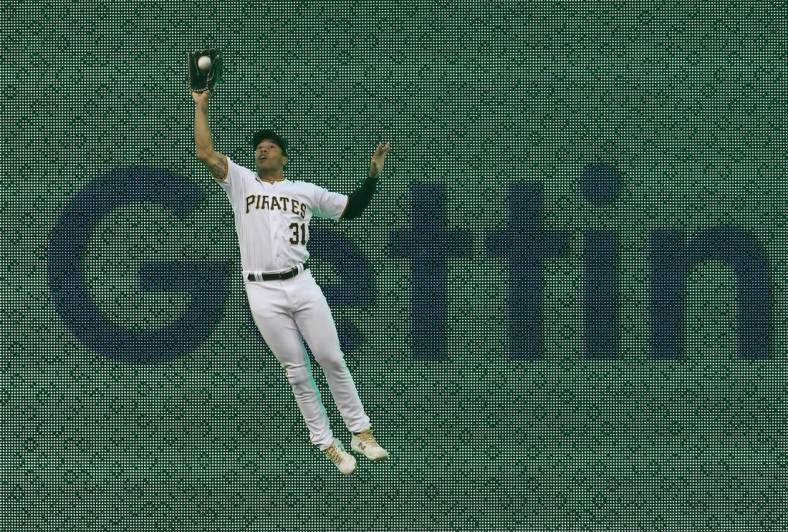 May 24, 2022; Pittsburgh, Pennsylvania, USA; Pittsburgh Pirates right fielder Cal Mitchell (31) makes a leaping catch for an out on a ball hit by Colorado Rockies right fielder Charlie Blackmon (not pictured) during the third inning at PNC Park. Mandatory Credit: Charles LeClaire-USA TODAY Sports