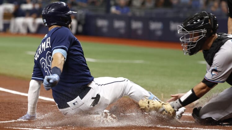 May 24, 2022; St. Petersburg, Florida, USA; Tampa Bay Rays center fielder Kevin Kiermaier (39) slides home to score a run on a in the park home run during the first inning against the Miami Marlins at Tropicana Field. Mandatory Credit: Kim Klement-USA TODAY Sports