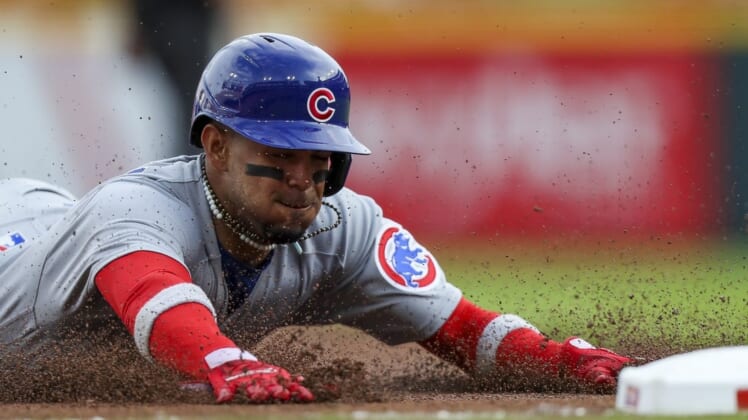 May 24, 2022; Cincinnati, Ohio, USA; Chicago Cubs second baseman Christopher Morel (5) slides into third on a single hit by center fielder Rafael Ortega (not pictured) in the first inning against the Cincinnati Reds at Great American Ball Park. Mandatory Credit: Katie Stratman-USA TODAY Sports