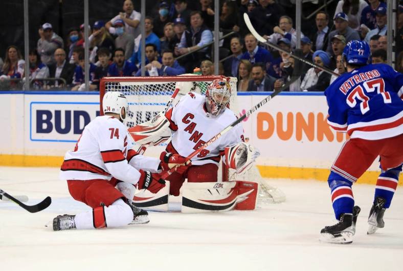 May 24, 2022; New York, New York, USA; New York Rangers center Frank Vatrano (77) scores a goal on Carolina Hurricanes goalie Antti Raanta (32) during the first period in game four of the second round of the 2022 Stanley Cup Playoffs at Madison Square Garden. Mandatory Credit: Danny Wild-USA TODAY Sports