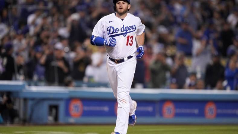 May 4, 2022; Los Angeles, California, USA; Los Angeles Dodgers third baseman Max Muncy (13) rounds the bases after hitting a two-run home run in the eighth inning against the San Francisco Giants at Dodger Stadium. Mandatory Credit: Kirby Lee-USA TODAY Sports