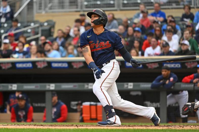 May 24, 2022; Minneapolis, Minnesota, USA;  Minnesota Twins third base Gio Urshela (15) hits an RBI single against the Detroit Tigers during the second inning at Target Field. Mandatory Credit: Nick Wosika-USA TODAY Sports