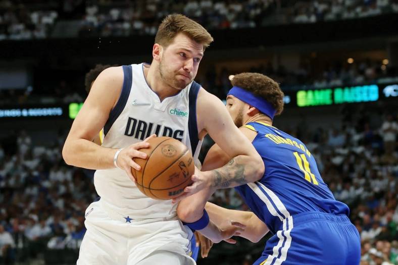 May 24, 2022; Dallas, Texas, USA; Dallas Mavericks guard Luka Doncic (77) drives to the basket against Golden State Warriors guard Klay Thompson (11) during the first quarter in game four of the 2022 Western Conference finals at American Airlines Center. Mandatory Credit: Kevin Jairaj-USA TODAY Sports