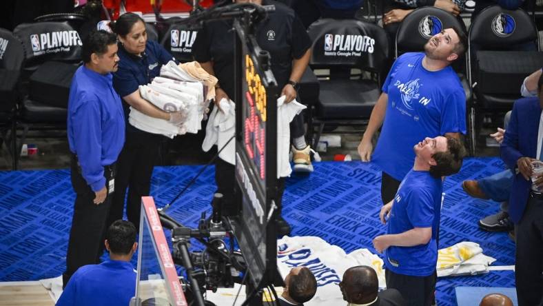 May 24, 2022; Dallas, Texas, USA; Members of the arena staff put down towels to absorb water from a leaking roof before the start of the third quarter between the Dallas Mavericks and the Golden State Warriors in game four of the 2022 western conference finals at American Airlines Center. Mandatory Credit: Jerome Miron-USA TODAY Sports