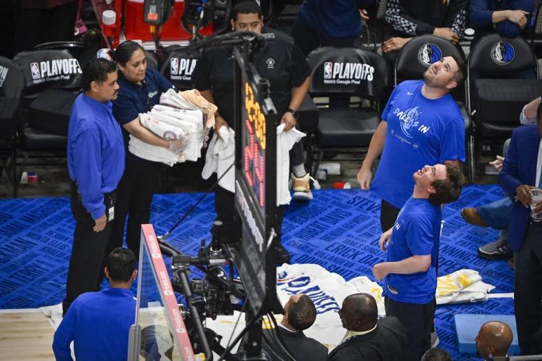 May 24, 2022; Dallas, Texas, USA; Members of the arena staff put down towels to absorb water from a leaking roof before the start of the third quarter between the Dallas Mavericks and the Golden State Warriors in game four of the 2022 western conference finals at American Airlines Center. Mandatory Credit: Jerome Miron-USA TODAY Sports