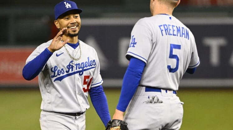 May 24, 2022; Washington, District of Columbia, USA; Los Angeles Dodgers right fielder Mookie Betts (50) and first baseman Freddie Freeman (5) celebrate after the game against the Washington Nationals at Nationals Park. Mandatory Credit: Brad Mills-USA TODAY Sports