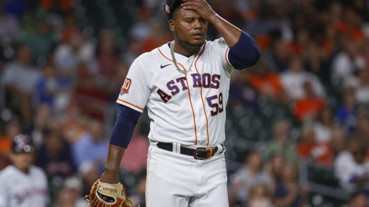 May 24, 2022; Houston, Texas, USA; Houston Astros starting pitcher Framber Valdez (59) reacts after a play during the seventh inning against the Cleveland Guardians at Minute Maid Park. Mandatory Credit: Troy Taormina-USA TODAY Sports