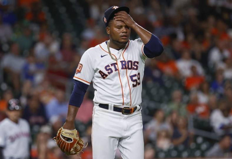 May 24, 2022; Houston, Texas, USA; Houston Astros starting pitcher Framber Valdez (59) reacts after a play during the seventh inning against the Cleveland Guardians at Minute Maid Park. Mandatory Credit: Troy Taormina-USA TODAY Sports