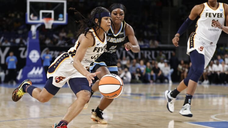 May 24, 2022; Chicago, Illinois, USA; Indiana Fever guard Destanni Henderson (33) drives to the basket against the Chicago Sky during the second half at Wintrust Arena. Mandatory Credit: Kamil Krzaczynski-USA TODAY Sports