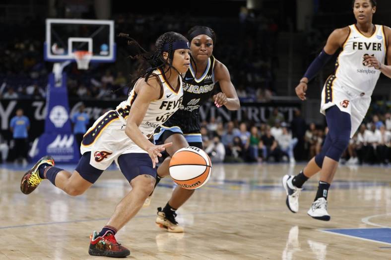 May 24, 2022; Chicago, Illinois, USA; Indiana Fever guard Destanni Henderson (33) drives to the basket against the Chicago Sky during the second half at Wintrust Arena. Mandatory Credit: Kamil Krzaczynski-USA TODAY Sports