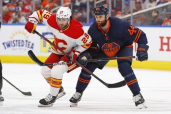 May 24, 2022; Edmonton, Alberta, CAN; Edmonton Oilers forward Zack Kassian (44) and Calgary Flames forward Dillon Dube (29) look for a loose puck during the second periodin game four of the second round of the 2022 Stanley Cup Playoffs at Rogers Place. Mandatory Credit: Perry Nelson-USA TODAY Sports