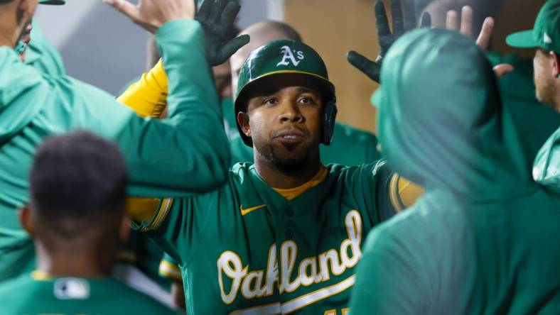 May 24, 2022; Seattle, Washington, USA; Oakland Athletics shortstop Elvis Andrus (17) celebrates in the dugout after hitting a solo-home run against the Seattle Mariners during the sixth inning at T-Mobile Park. Mandatory Credit: Joe Nicholson-USA TODAY Sports