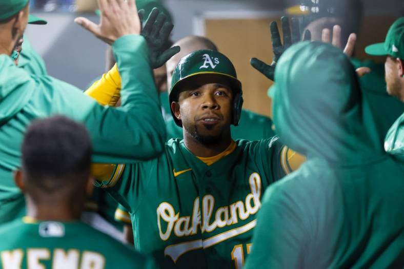 May 24, 2022; Seattle, Washington, USA; Oakland Athletics shortstop Elvis Andrus (17) celebrates in the dugout after hitting a solo-home run against the Seattle Mariners during the sixth inning at T-Mobile Park. Mandatory Credit: Joe Nicholson-USA TODAY Sports