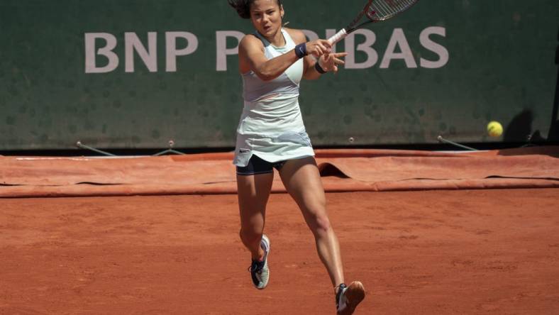 May 25, 2022; Paris, France; Emma Raducanu (GBR) returns a shot from Aliaksandra Sasnovich during their match on day four of the French Open at Stade Roland-Garros. Mandatory Credit: Susan Mullane-USA TODAY Sports