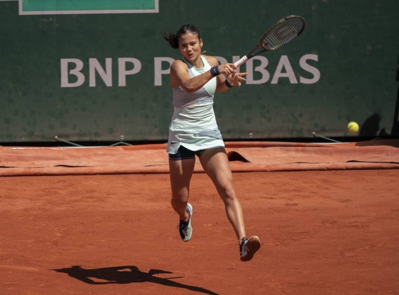 May 25, 2022; Paris, France; Emma Raducanu (GBR) returns a shot from Aliaksandra Sasnovich during their match on day four of the French Open at Stade Roland-Garros. Mandatory Credit: Susan Mullane-USA TODAY Sports