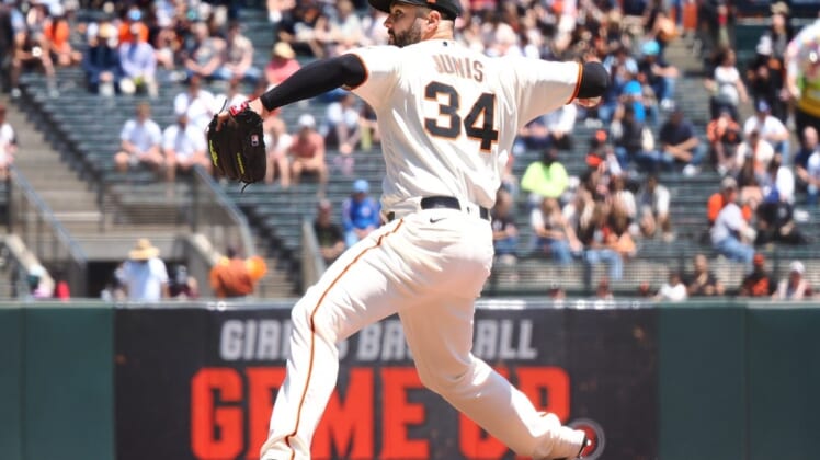May 25, 2022; San Francisco, California, USA; San Francisco Giants starting pitcher Jakob Junis (34) pitches the ball against the New York Mets during the first inning at Oracle Park. Mandatory Credit: Kelley L Cox-USA TODAY Sports