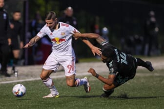 May 25, 2022; Montclair, New Jersey, USA; New York Red Bulls forward Patryk Klimala (9) plays the ball against Charlotte FC defender Christian Makoun (14) during the first half at Montclair State University Soccer Park. Mandatory Credit: Vincent Carchietta-USA TODAY Sports