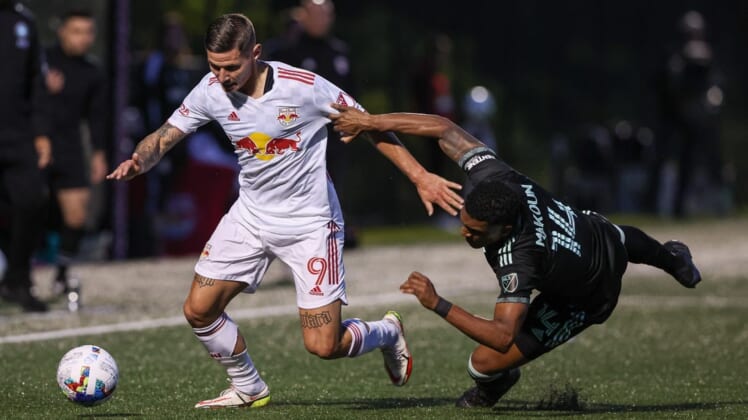 May 25, 2022; Montclair, New Jersey, USA; New York Red Bulls forward Patryk Klimala (9) plays the ball against Charlotte FC defender Christian Makoun (14) during the first half at Montclair State University Soccer Park. Mandatory Credit: Vincent Carchietta-USA TODAY Sports