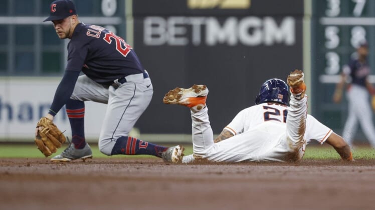 May 25, 2022; Houston, Texas, USA; Houston Astros right fielder Jose Siri (26) slides safely into second with a stolen base as Cleveland Guardians second baseman Ernie Clement (28) attempts to apply a tag during the third inning at Minute Maid Park. Mandatory Credit: Troy Taormina-USA TODAY Sports