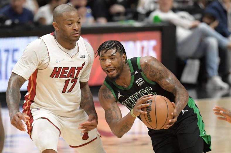 May 25, 2022; Miami, Florida, USA; Boston Celtics guard Marcus Smart (36) drives to the basket against Miami Heat forward P.J. Tucker (17) during the second half of game five of the 2022 eastern conference finals at FTX Arena. Mandatory Credit: Jim Rassol-USA TODAY Sports
