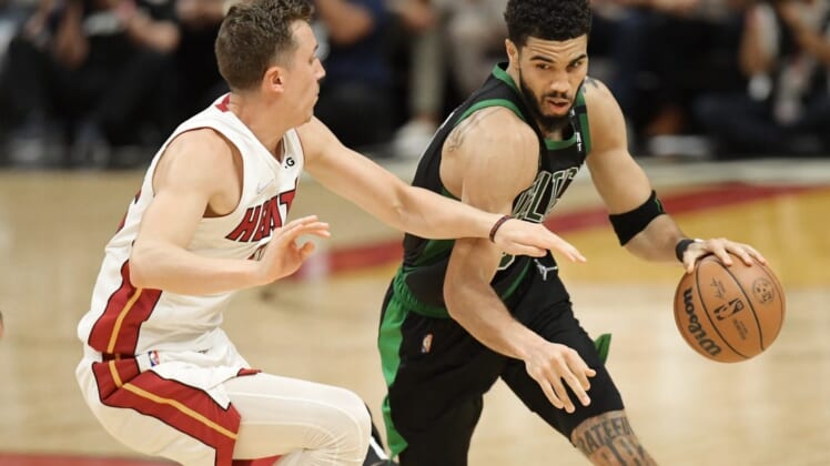 May 25, 2022; Miami, Florida, USA; Boston Celtics forward Jayson Tatum (0) drives to the basket against Miami Heat guard Duncan Robinson (55) during the second half of game five of the 2022 eastern conference finals at FTX Arena. Mandatory Credit: Jim Rassol-USA TODAY Sports