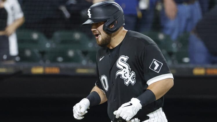May 25, 2022; Chicago, Illinois, USA; Chicago White Sox third baseman Jake Burger (30) smiles as he rounds the bases after hitting a three-run home run against the Boston Red Sox during the fifth inning at Guaranteed Rate Field. Mandatory Credit: Kamil Krzaczynski-USA TODAY Sports
