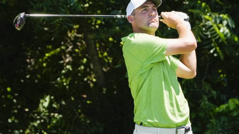 May 26, 2022; Fort Worth, Texas, USA; Scottie Scheffler plays his shot from the sixth tee during the first round of the Charles Schwab Challenge golf tournament. Mandatory Credit: Jim Cowsert-USA TODAY Sports