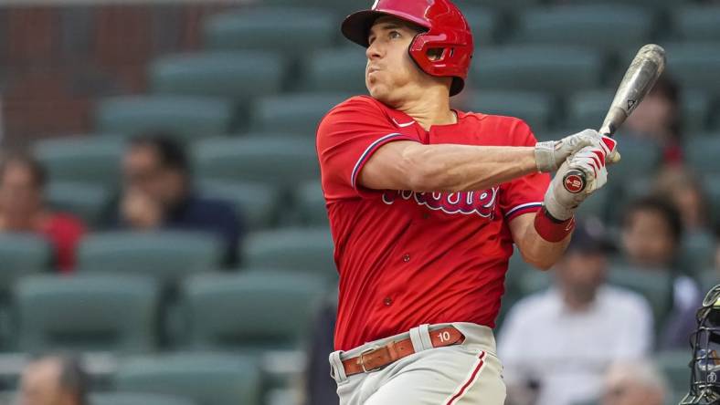 May 26, 2022; Cumberland, Georgia, USA; Philadelphia Phillies catcher J.T. Realmuto (10) hits a home run against the Atlanta Braves during the third inning at Truist Park. Mandatory Credit: Dale Zanine-USA TODAY Sports