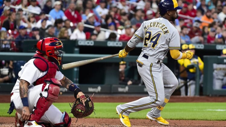 May 26, 2022; St. Louis, Missouri, USA;  Milwaukee Brewers designated hitter Andrew McCutchen (24) hits a one run single against the St. Louis Cardinals during the fourth inning at Busch Stadium. Mandatory Credit: Jeff Curry-USA TODAY Sports