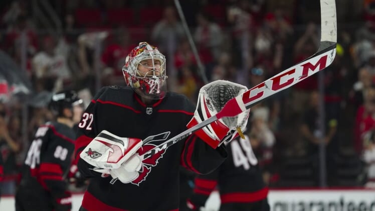 May 26, 2022; Raleigh, North Carolina, USA; Carolina Hurricanes goaltender Antti Raanta (32) celebrates a win against the New York Rangers in game five of the second round of the 2022 Stanley Cup Playoffs at PNC Arena. Mandatory Credit: James Guillory-USA TODAY Sports