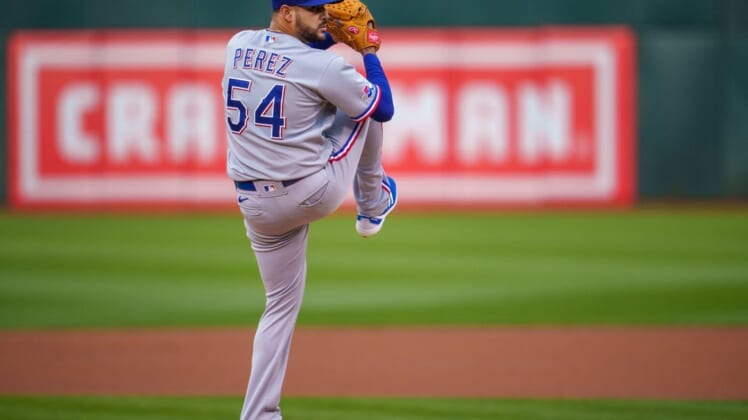 May 26, 2022; Oakland, California, USA; Texas Rangers starting pitcher Martin Perez (54) delivers a pitch during the first inning against the Oakland Athletics at RingCentral Coliseum. Mandatory Credit: Neville E. Guard-USA TODAY Sports