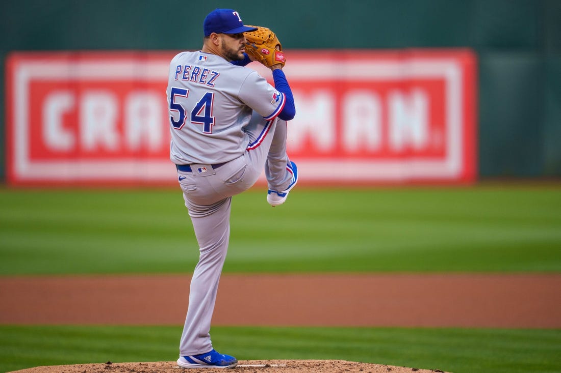 May 26, 2022; Oakland, California, USA; Texas Rangers starting pitcher Martin Perez (54) delivers a pitch during the first inning against the Oakland Athletics at RingCentral Coliseum. Mandatory Credit: Neville E. Guard-USA TODAY Sports