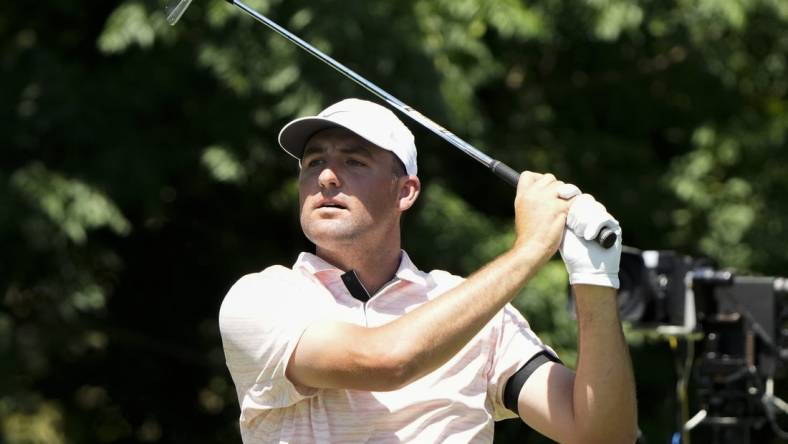 May 27, 2022; Fort Worth, Texas, USA; Scottie Scheffler plays his shot from the eighth tee during the second round of the Charles Schwab Challenge golf tournament. Mandatory Credit: Jim Cowsert-USA TODAY Sports