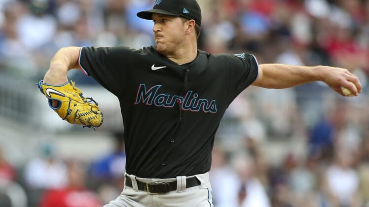 May 27, 2022; Atlanta, Georgia, USA; Miami Marlins starting pitcher Trevor Rogers (28) throws against the Atlanta Braves in the first inning at Truist Park. Mandatory Credit: Brett Davis-USA TODAY Sports