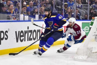 May 27, 2022; St. Louis, Missouri, USA; St. Louis Blues defenseman Robert Bortuzzo (41) controls the puck as Colorado Avalanche left wing J.T. Compher (37) defends during the first period in game six of the second round of the 2022 Stanley Cup Playoffs at Enterprise Center. Mandatory Credit: Jeff Curry-USA TODAY Sports
