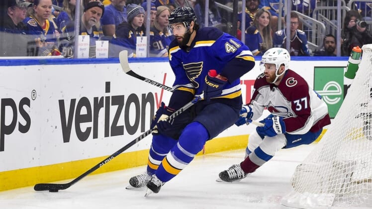 May 27, 2022; St. Louis, Missouri, USA; St. Louis Blues defenseman Robert Bortuzzo (41) controls the puck as Colorado Avalanche left wing J.T. Compher (37) defends during the first period in game six of the second round of the 2022 Stanley Cup Playoffs at Enterprise Center. Mandatory Credit: Jeff Curry-USA TODAY Sports
